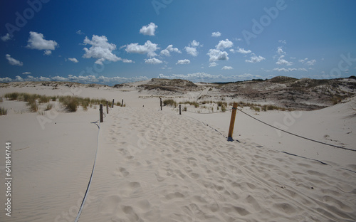 View of endless wandering sand dunes in sunny ,sommer day. Wydma Czolpinska, Slowinski National Park on the Baltic Sea in northern Poland. photo