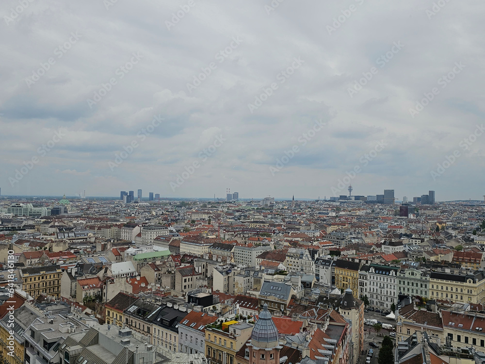 Naklejka premium Panorama of Vienna taken on a cloudy summer day from the top of one of the WWII air defense towers, Vienna, Austria.