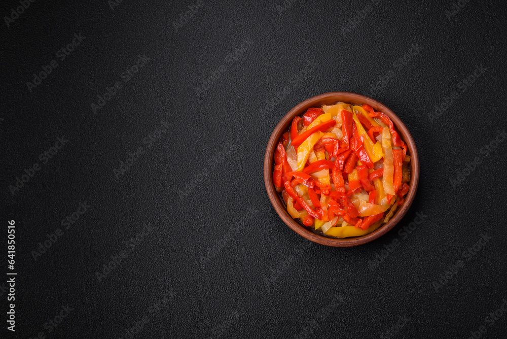 Delicious fresh saute sweet bell pepper slices with onion, salt, spices and herbs