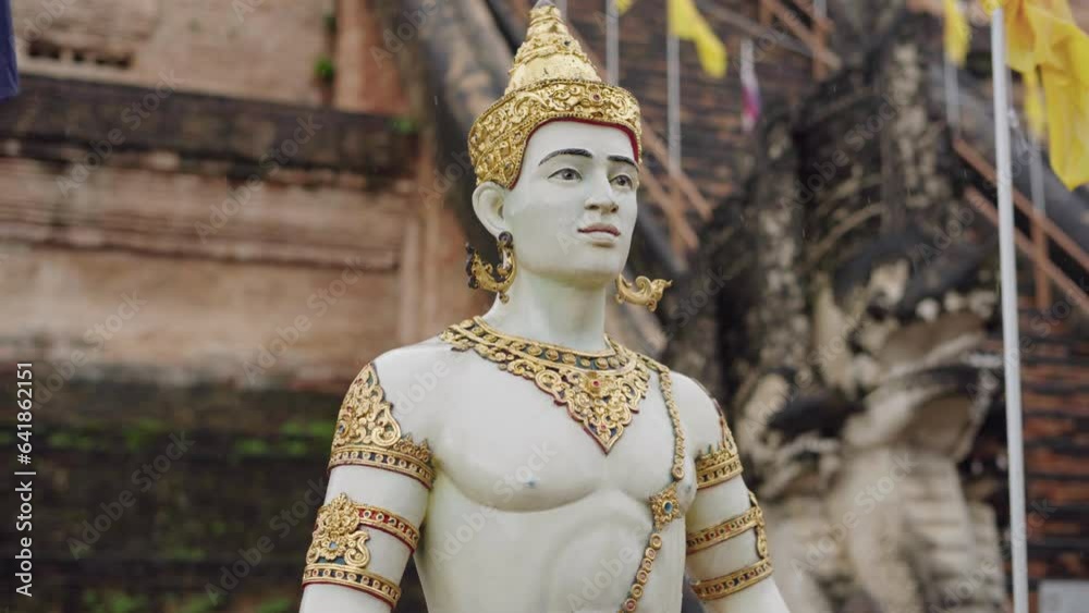 statues of a warrior with golden details inside the temple of wat chedi luang in chiang mai, thailand