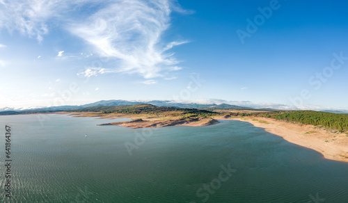 Aerial view of the Aguilar de Campoo reservoir on a summer day