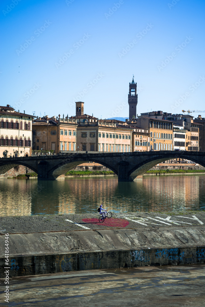Fototapeta premium Santa Trinita Bridge Over Arno River in Florence, Italy - Iconic Cityscape with Arnolfo Tower