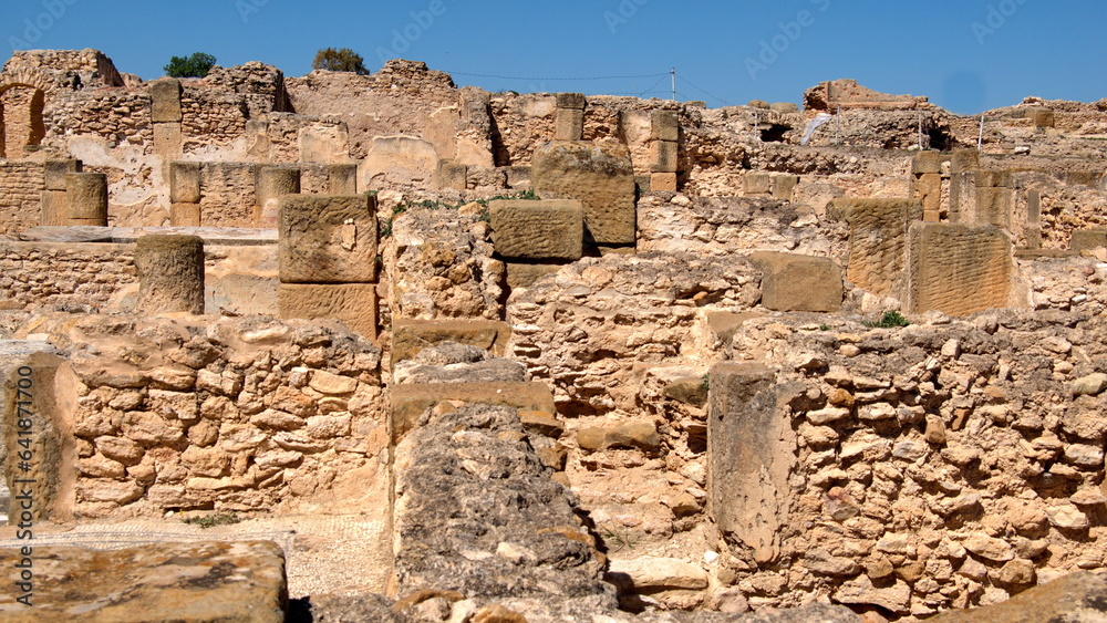 Stone walls and foundations in the Roman bath area of the Roman ruins at Oudna, outside of Tunis, Tunisia