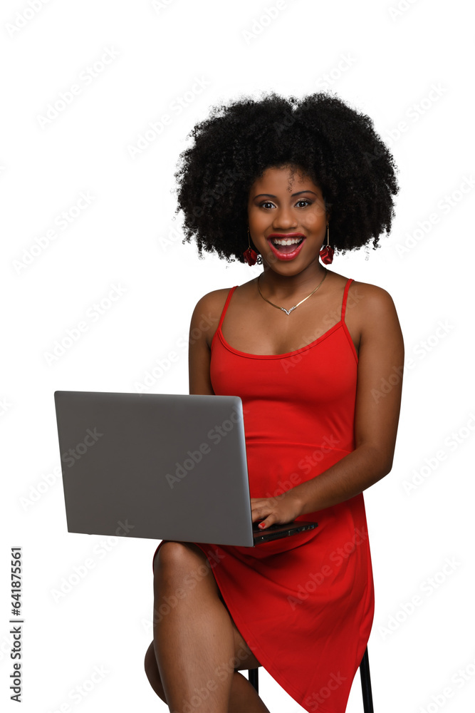woman with laptop typing on keyboard and looking at camera, black woman. woman with laptop typing on keyboard and looking at camera, black woman.