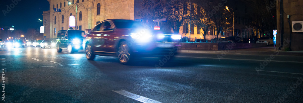 cars in city road at night