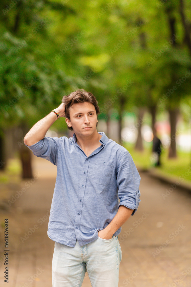 Portrait of man posing outside