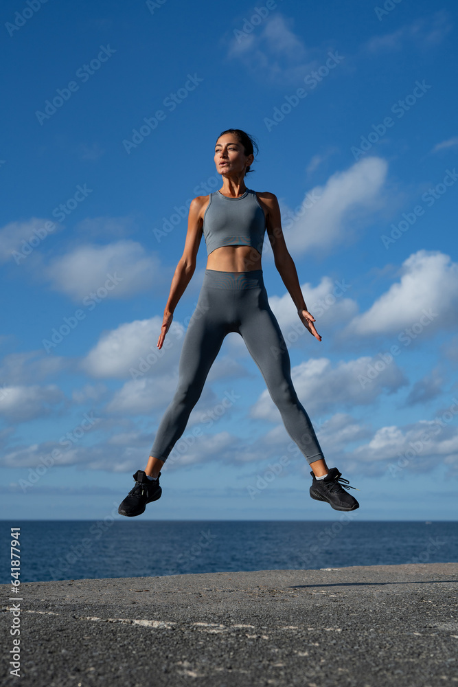 athletic brunette girl doing fitness doing exercises leading a healthy lifestyle athletic brunette girl doing fitness doing exercises leading a healthy lifestyle