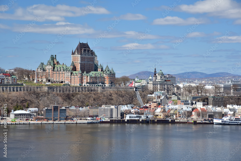 Old Quebec cityscape seen from Levis. Ferry on St-Lawrence river. Frontenac castle.