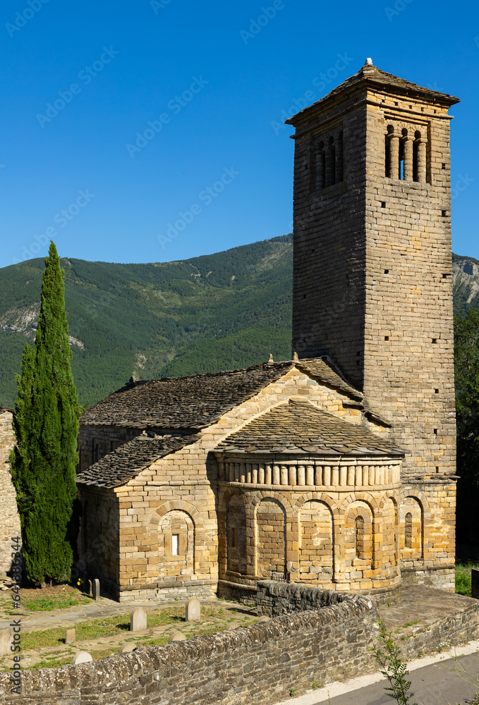 Stone building of the St. Peter Church consisting of the bell tower, sections and a semicircular apse