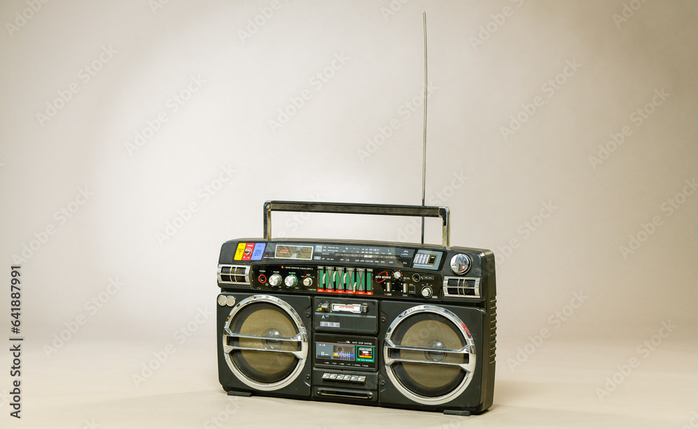 Obraz premium retro radio tape recorder on gray background isolated. disco music background.