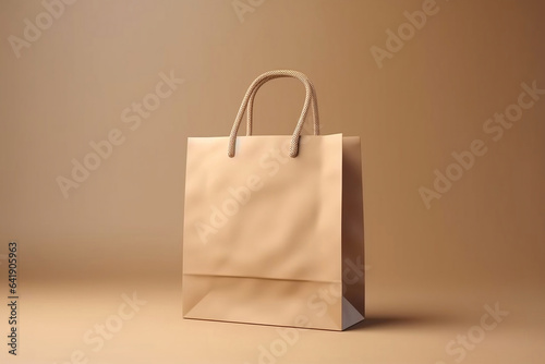 A brown paper shopping bag isolated on beige background, mock up, no brand, consumer and online shopping concept.