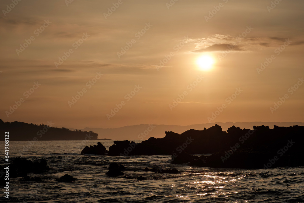 Sawarna beach,west Java,Indonesia, beautiful beach with coral reefs dotted with greenery Sawarna beach,west Java,Indonesia, beautiful beach with coral reefs dotted with greenery