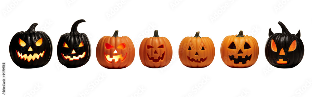 A line of intricately carved pumpkin faces in the dark A line of intricately carved pumpkin faces in the dark