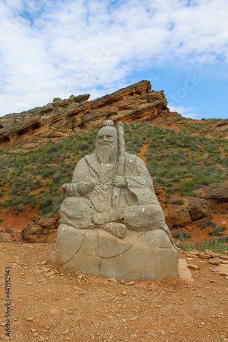 The guardian statue of the elderly teacher at mountain Big Bogdo Russia photo