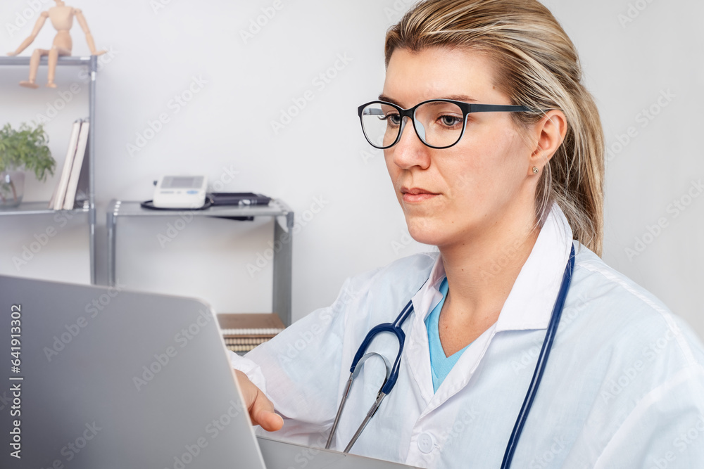 Doctor girl working on a computer