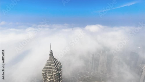 Timelapse of Shanghai cityscape and city skyline with cloudy sky.