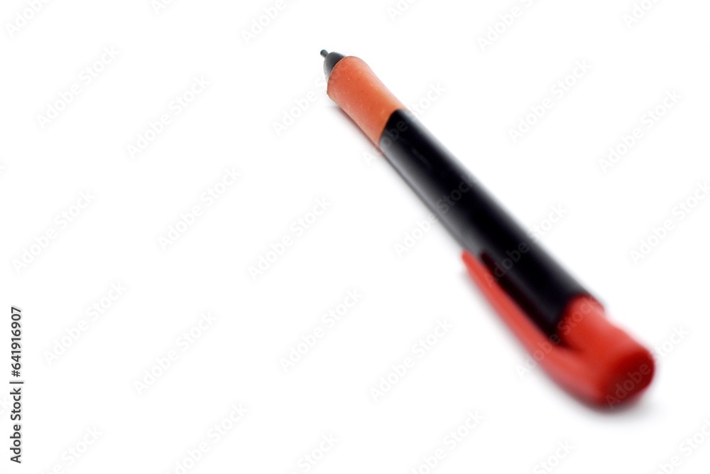 a mechanical pencil with red and black colors photographed on the isolated white background a mechanical pencil with red and black colors photographed on the isolated white background