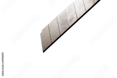 This large sized silver colored cutting knife made of metal is photographed on the isolated white background