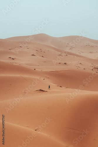 Incidental local berber man wandering through Sahara Desert Merzouga  Morocco