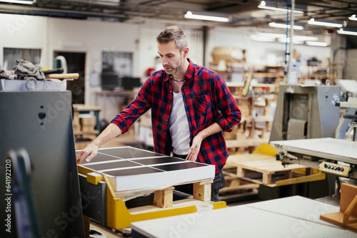 Middle aged caucasian man working in a printing press office