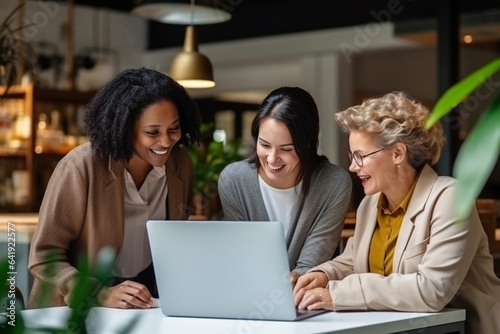 Generative AI : Joy of teamwork. Female coworkers using laptop,
