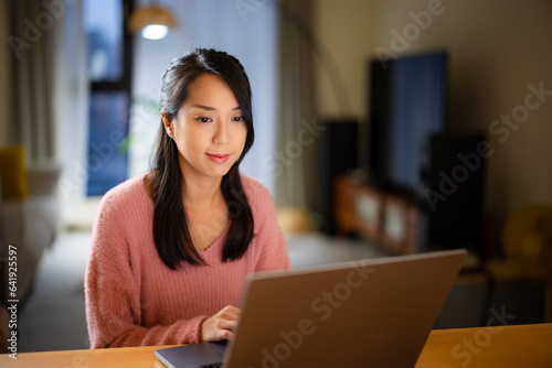 Housewife work on laptop computer at home
