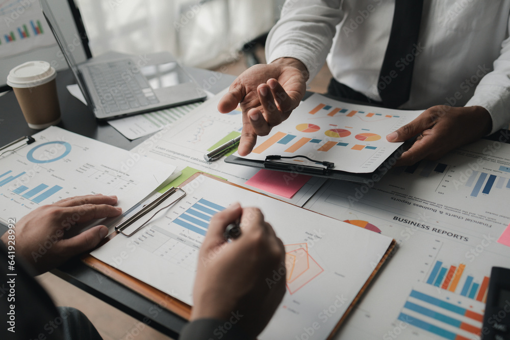 In a meeting between the finance and marketing departments to discuss work plans, two startup employees are brainstorming ideas for a profitable operating plan. Planning meeting concept.