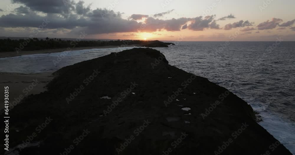 Sunset over the beach at Arecibo Puerto Rico with a drone over a Rocky Shore 2