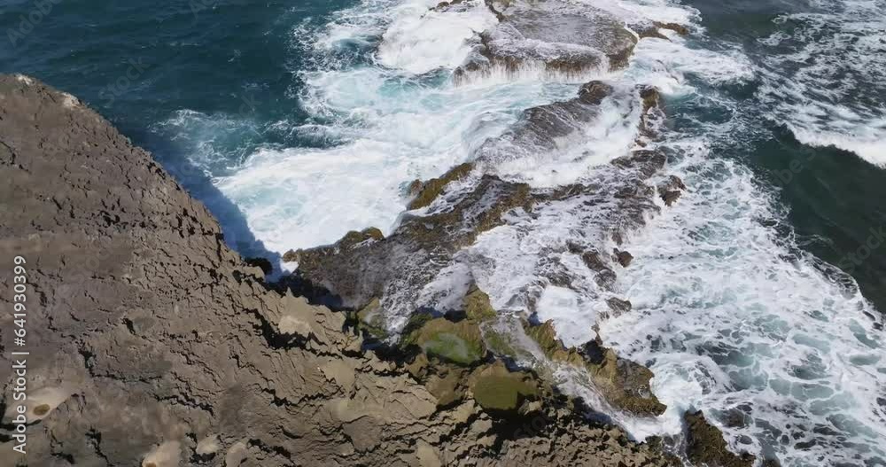 Rocky Shore formation at the Beach on Arecibo Puerto Rico with waves hitting the rocks