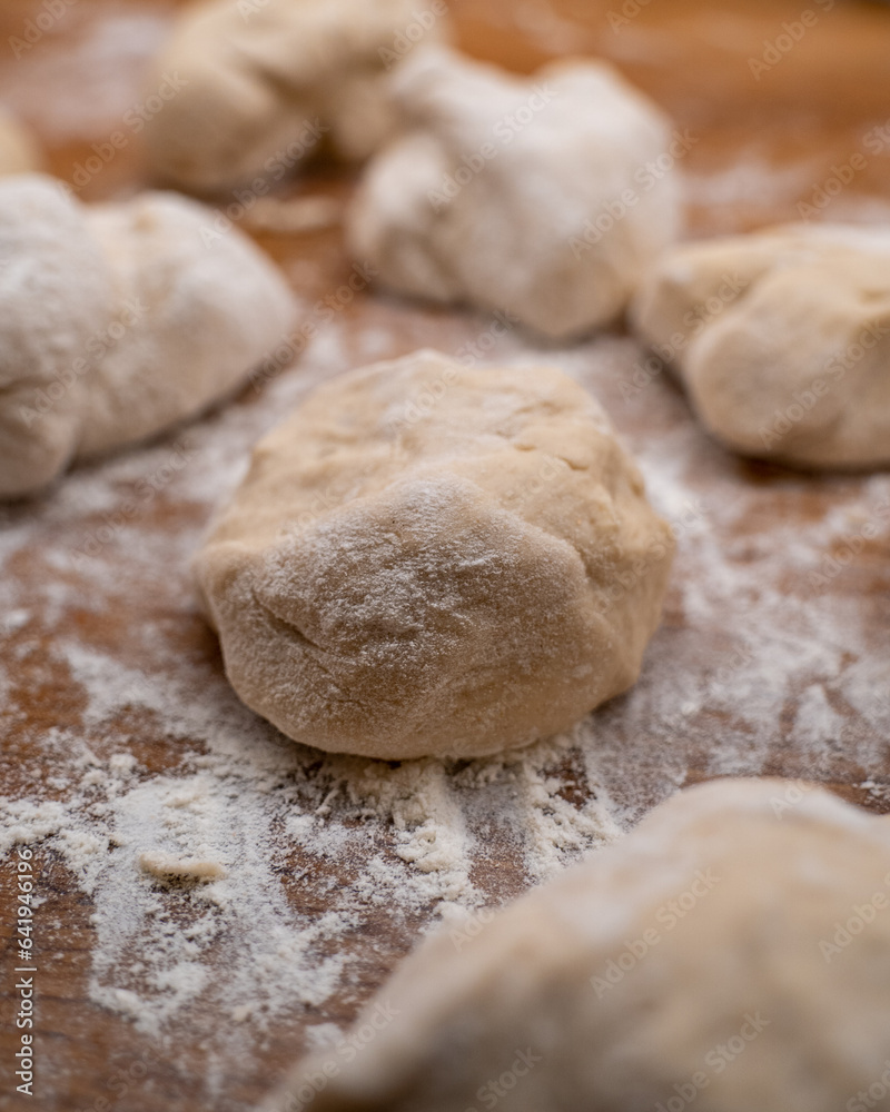 balls of dough on wooden countertop