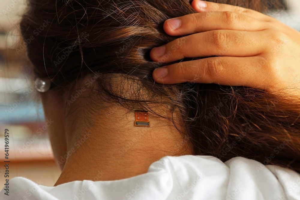 Obraz premium We are connected. Connection port on a woman's neck. Cyborg Woman Concept. Person with wearable technology