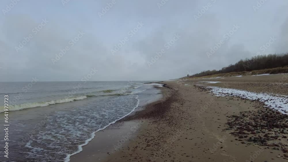 Beach and sea on cold dar day