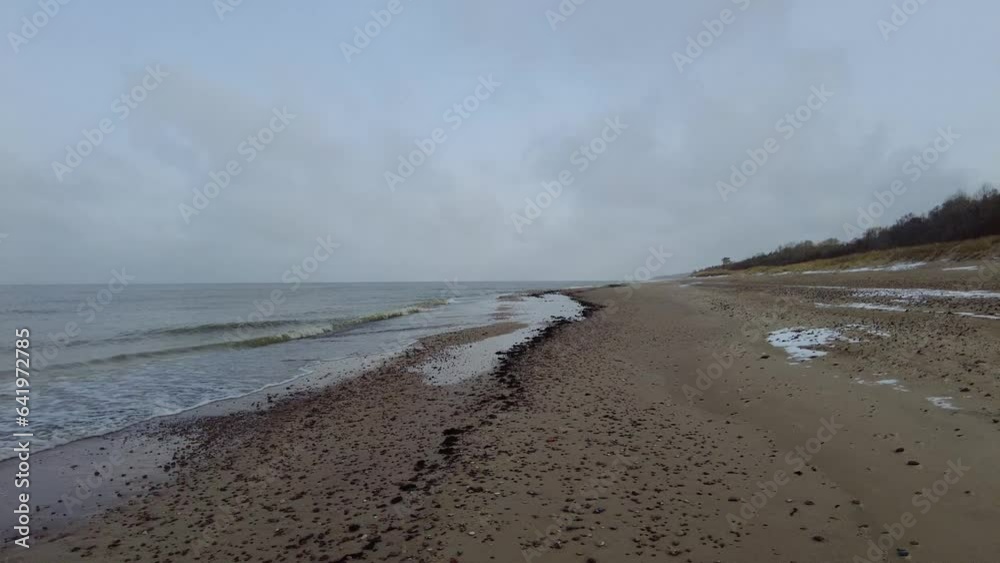 Beach and sea on cold dar day
