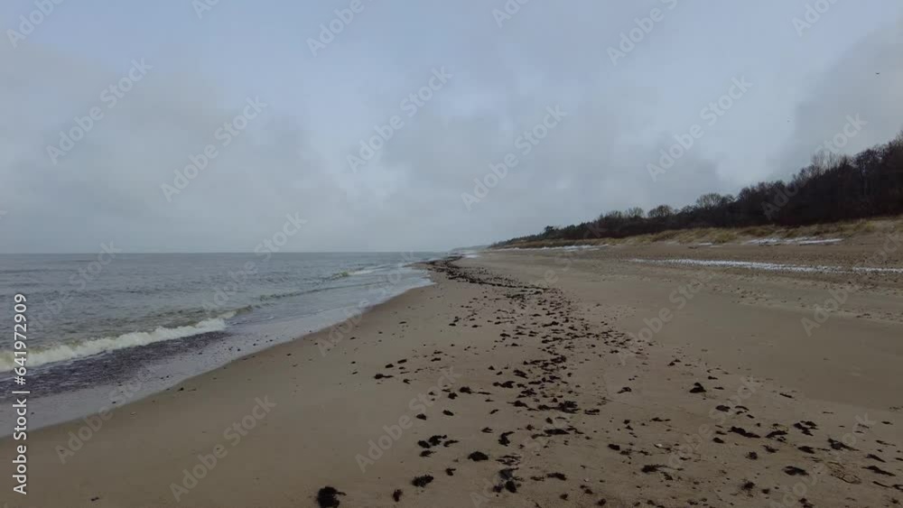 Beach and sea on cold dar day