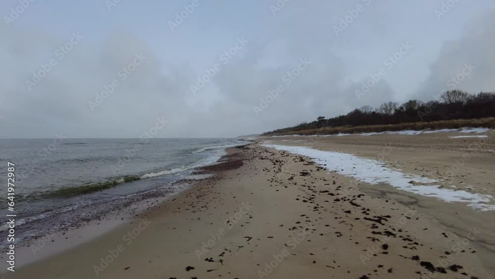 Beach and sea on cold dar day