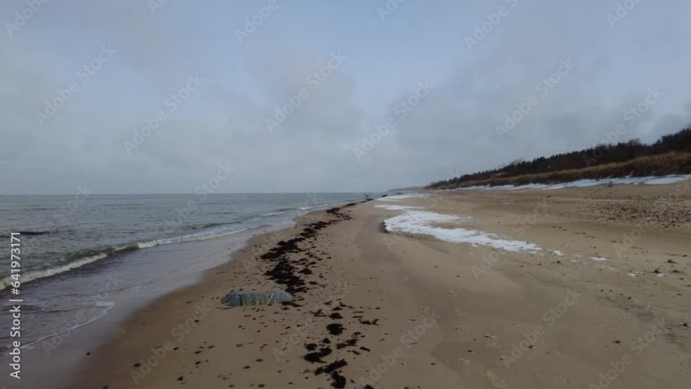 Beach and sea on cold dar day