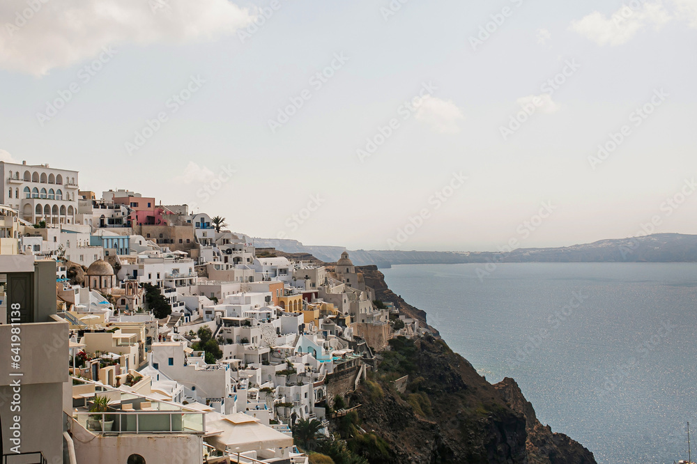 Picturesque view of Santorini, Oia, Greece. Medieval historic blue and white buildings and seaside view. Traditional European, Greek architecture. Summer holidays travel