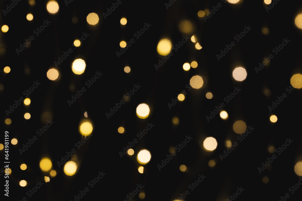Multiple yellow bokeh lights with copy space on dark background Multiple yellow bokeh lights with copy space on dark background