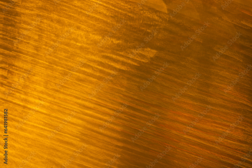 Yellow bokeh blurred lights with copy space on dark yellow background