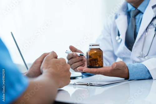 Doctor examines the health of male patient who has heart disease. physician who s an expert in the care of your heart and blood vessels   sign of abnormal heart rhythm or coronary artery disease.