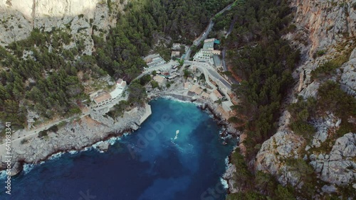 Sa Calobra Beach with Restauants, Hotels And Marina In Balearic Islands, Mallorca, Spain. - aerial photo