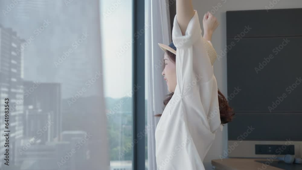 Asian beautiful woman lie down and jumping on bed at hotel, holiday vacation on summer day. Asian beautiful woman lie down and jumping on bed at hotel, holiday vacation on summer day.