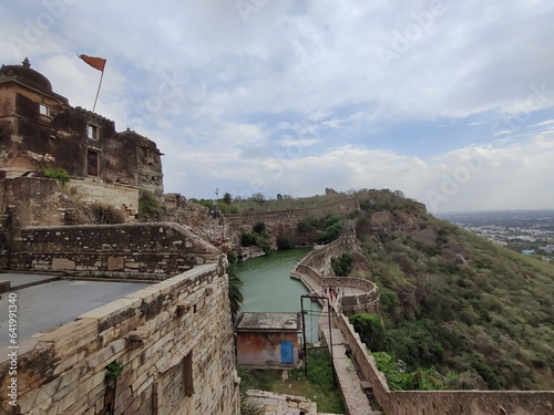 Picture of Gaumukh Kund at Chittorgarh Fort shot during daylight against white clouds and blue sky photo