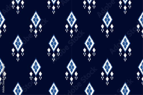 Seamless pattern in tribal,folk embroidery. Ethnic abstract ikat art. geometric art ornament print. Design for fabric,clothing,carpet,wallpaper,wrapping,cover,background