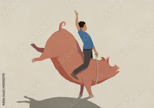 Man bull riding piggy bank
 photo