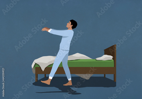 Man in pajamas sleepwalking along bed in nighttime bedroom
