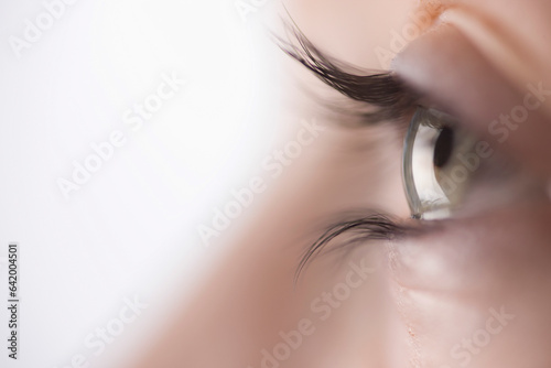 Extreme close up of young woman eye
 photo