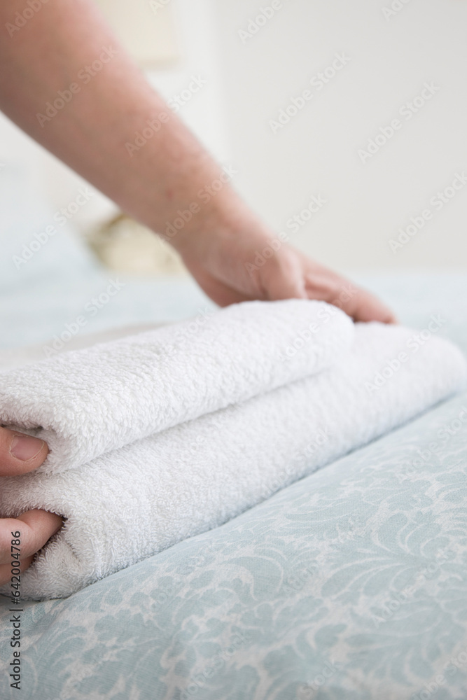 Close up of man hands adjusting towel on bed
Close up of man hands adjusting towel on bed