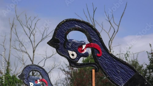 viking re-enactment colourful mascots on prow of a longboat at Waterford Ireland photo