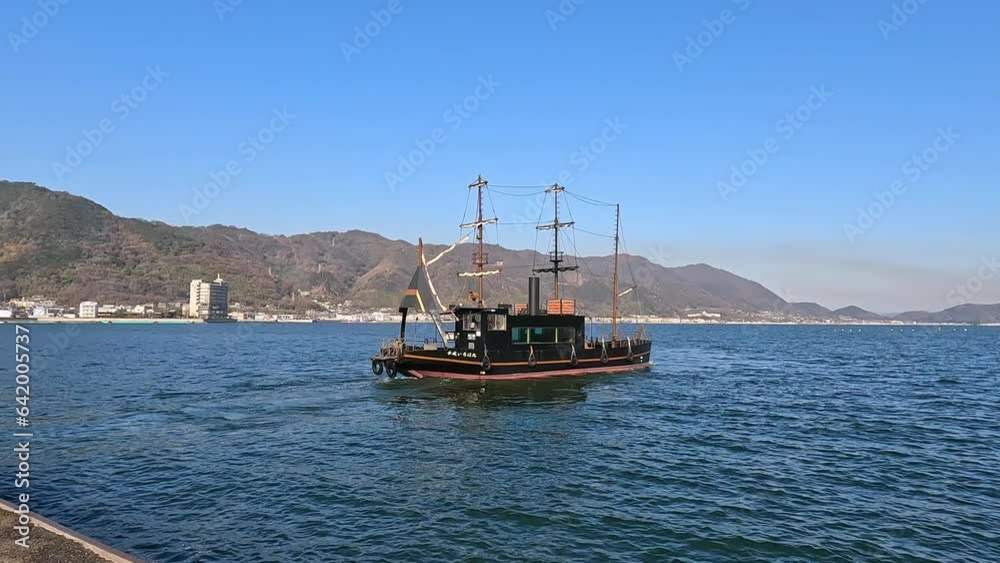 Day view of boats in the harbor of Tomonoura (Tomonotsu), a fishing port in the Ichichi ward of Fukuyama, Hiroshima. beautiful steam engine sailing boat Day view of boats in the harbor of Tomonoura (Tomonotsu), a fishing port in the Ichichi ward of Fukuyama, Hiroshima. beautiful steam engine sailing boat